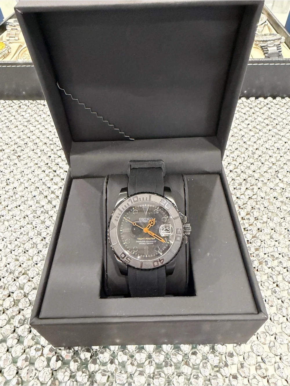 Seiko Men's Black Watch with Orange Hands and Markers